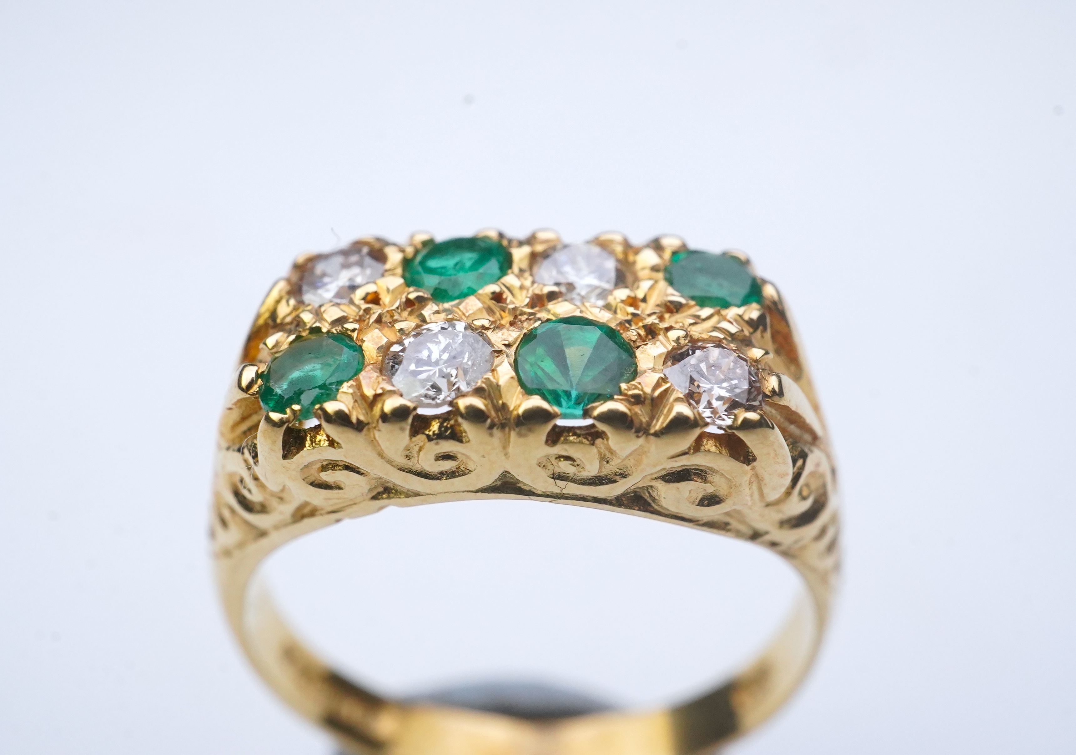 An emerald and diamond ring, circa 1975